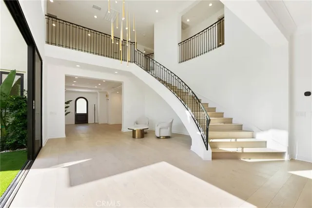 a view of a hallway with wooden floor and a fireplace