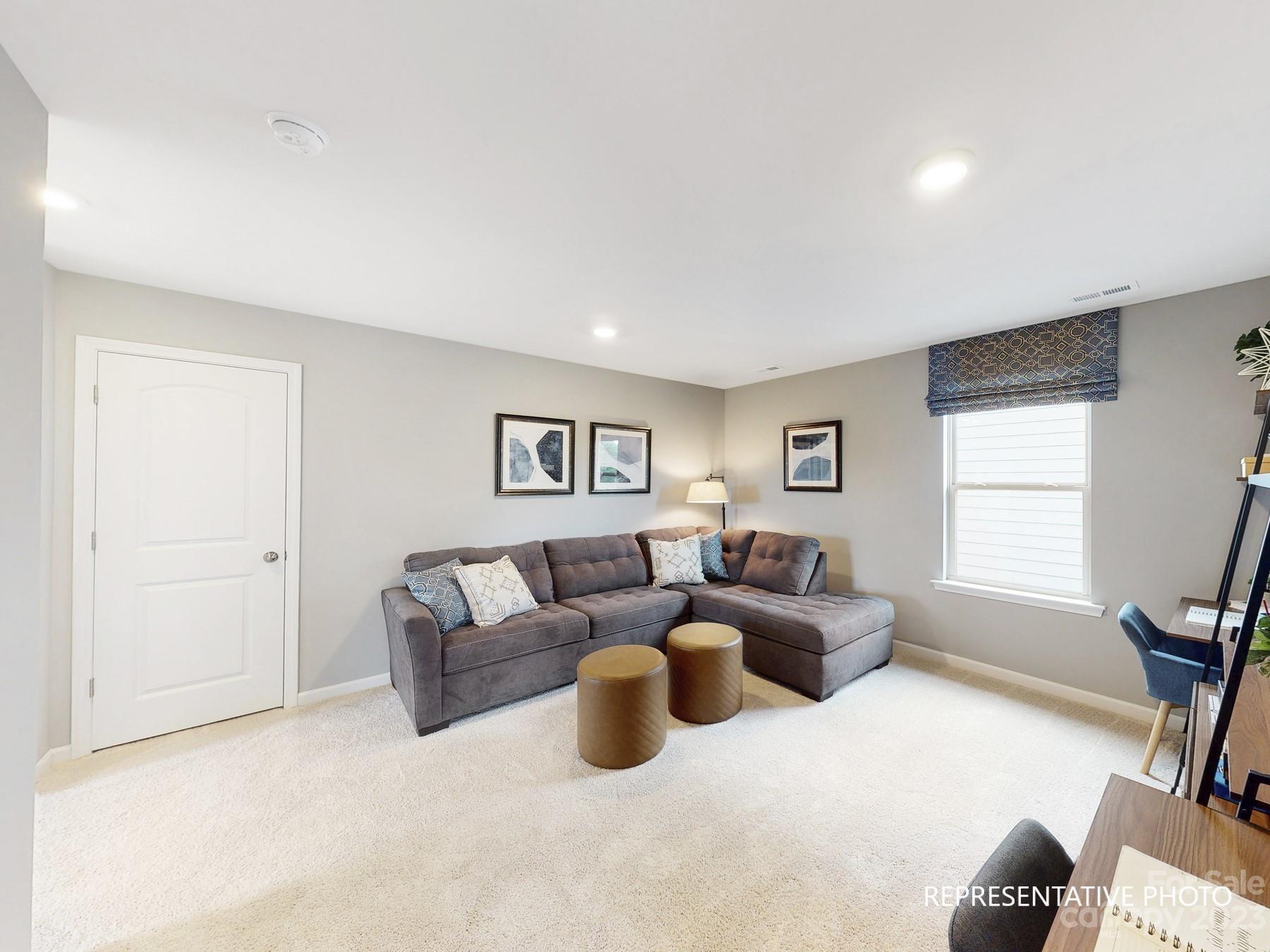 4911 Raspberry Knoll Drive, Unit 41 Charlotte, NC 28208 - Photo 20 of 29 a living room with furniture and a window