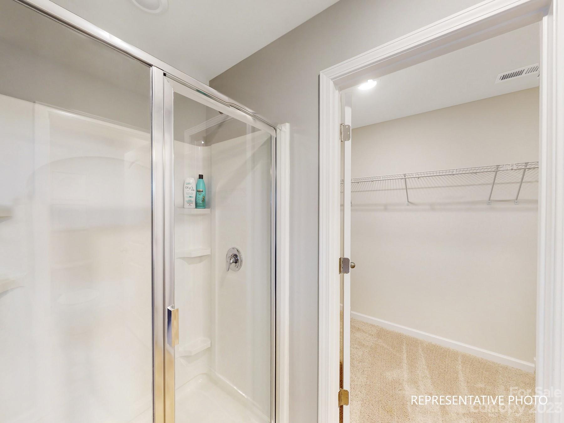 4911 Raspberry Knoll Drive, Unit 41 Charlotte, NC 28208 - Photo 21 of 29 a bathroom with a glass shower door
