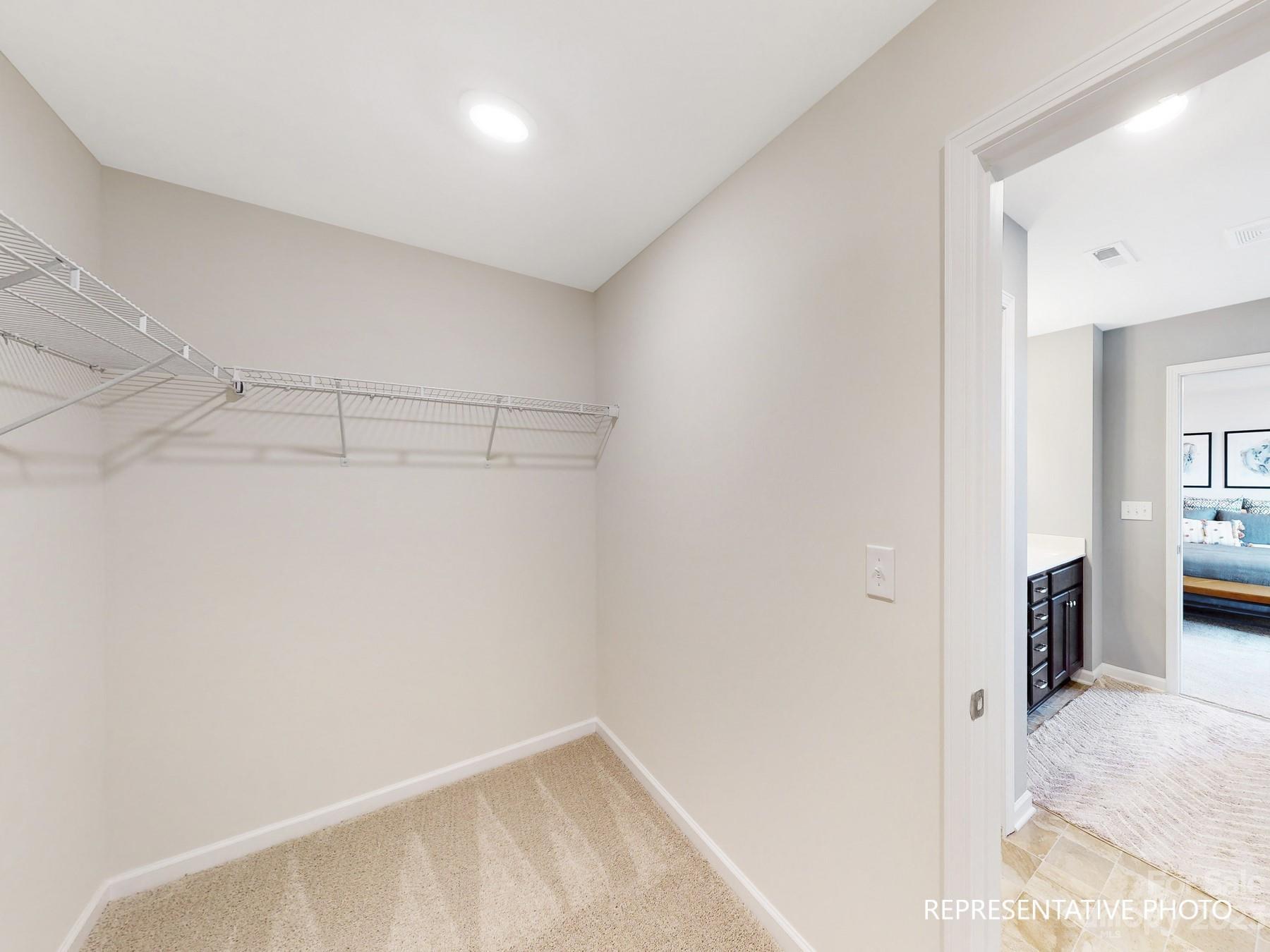 4911 Raspberry Knoll Drive, Unit 41 Charlotte, NC 28208 - Photo 26 of 29 a view of a room with racks on the wall