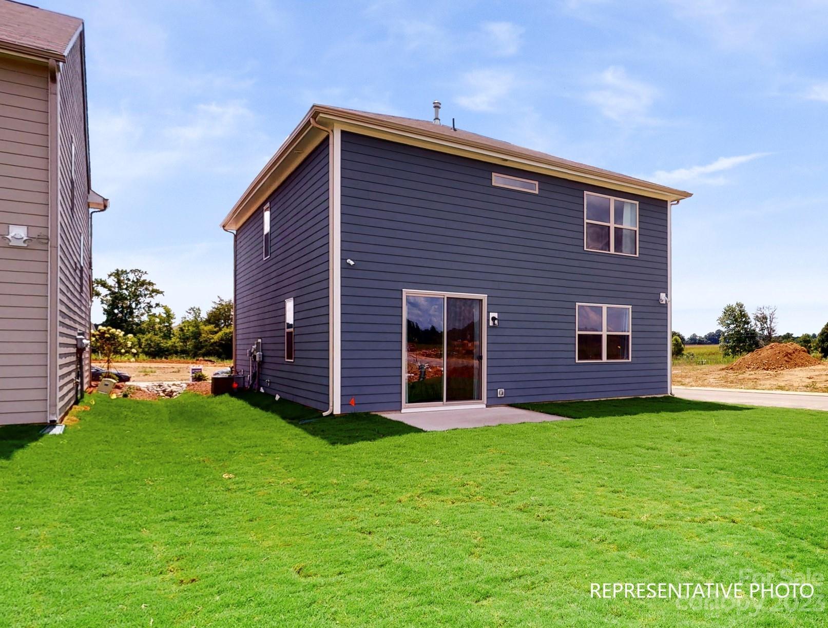 4911 Raspberry Knoll Drive, Unit 41 Charlotte, NC 28208 - Photo 27 of 29 a view of a house with a yard