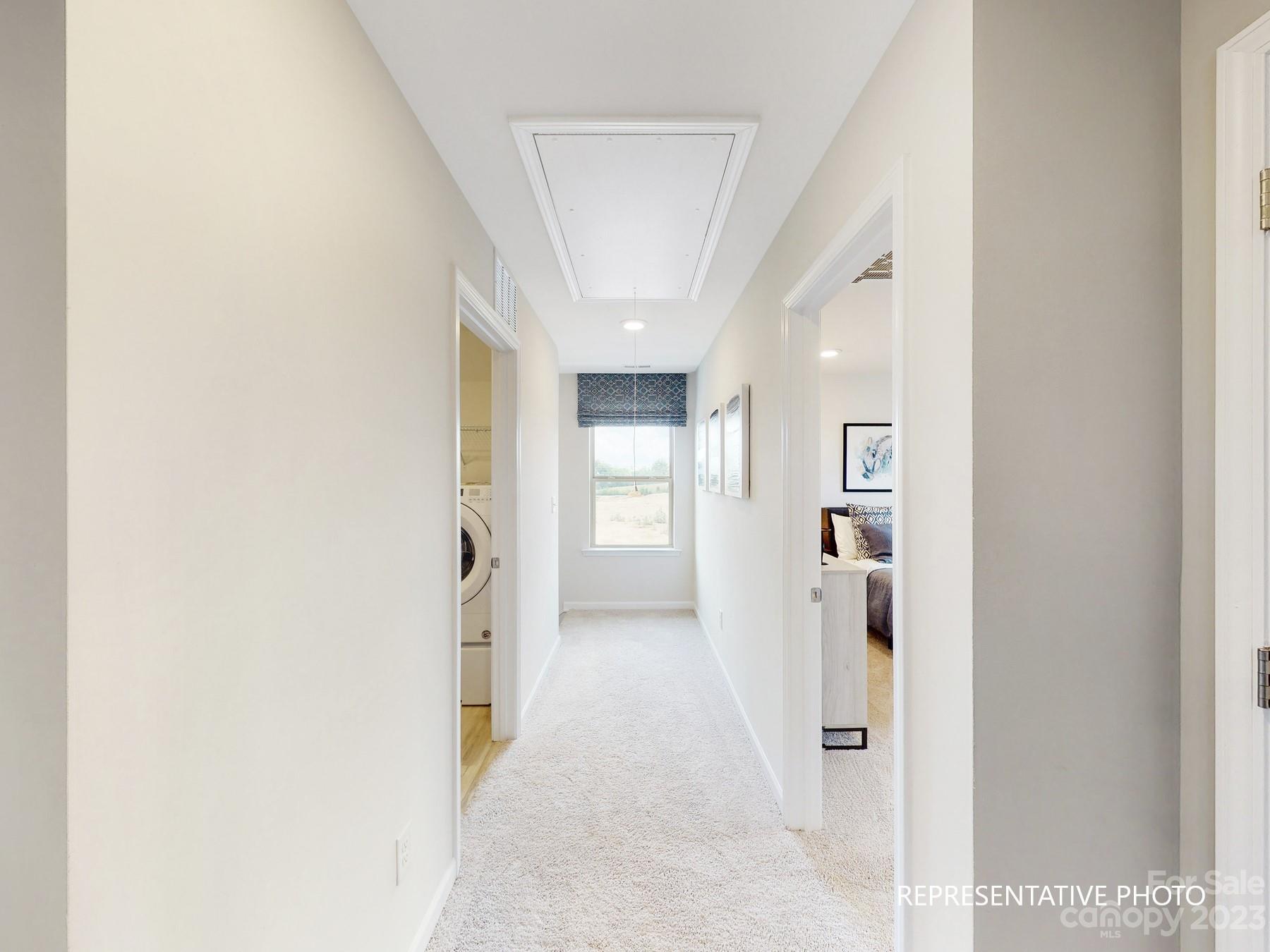 4911 Raspberry Knoll Drive, Unit 41 Charlotte, NC 28208 - Photo 28 of 29 a view of a hallway with wooden shelves