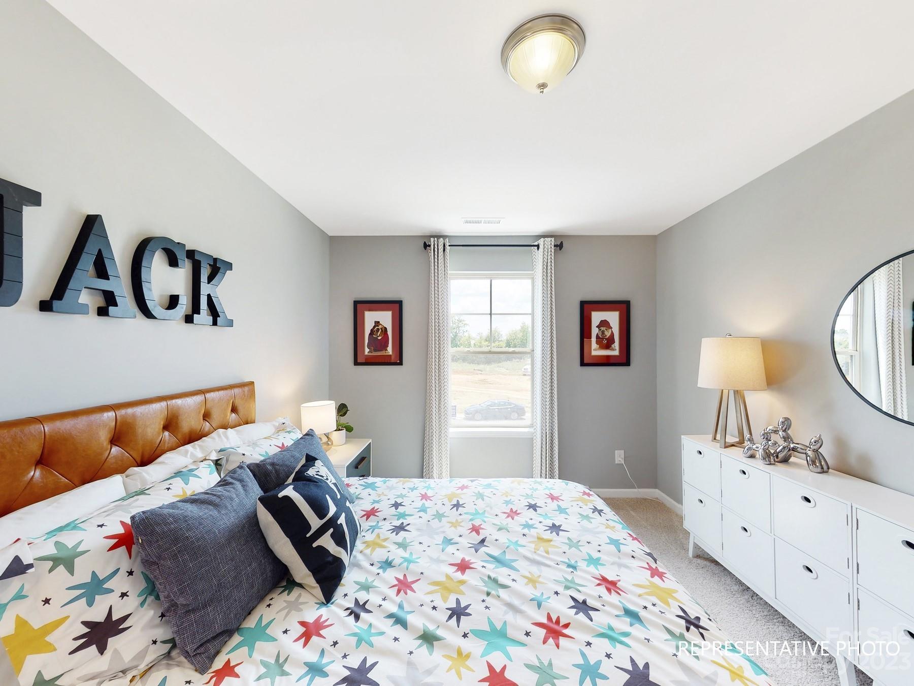 4911 Raspberry Knoll Drive, Unit 41 Charlotte, NC 28208 - Photo 4 of 29 a bedroom with a bed and window