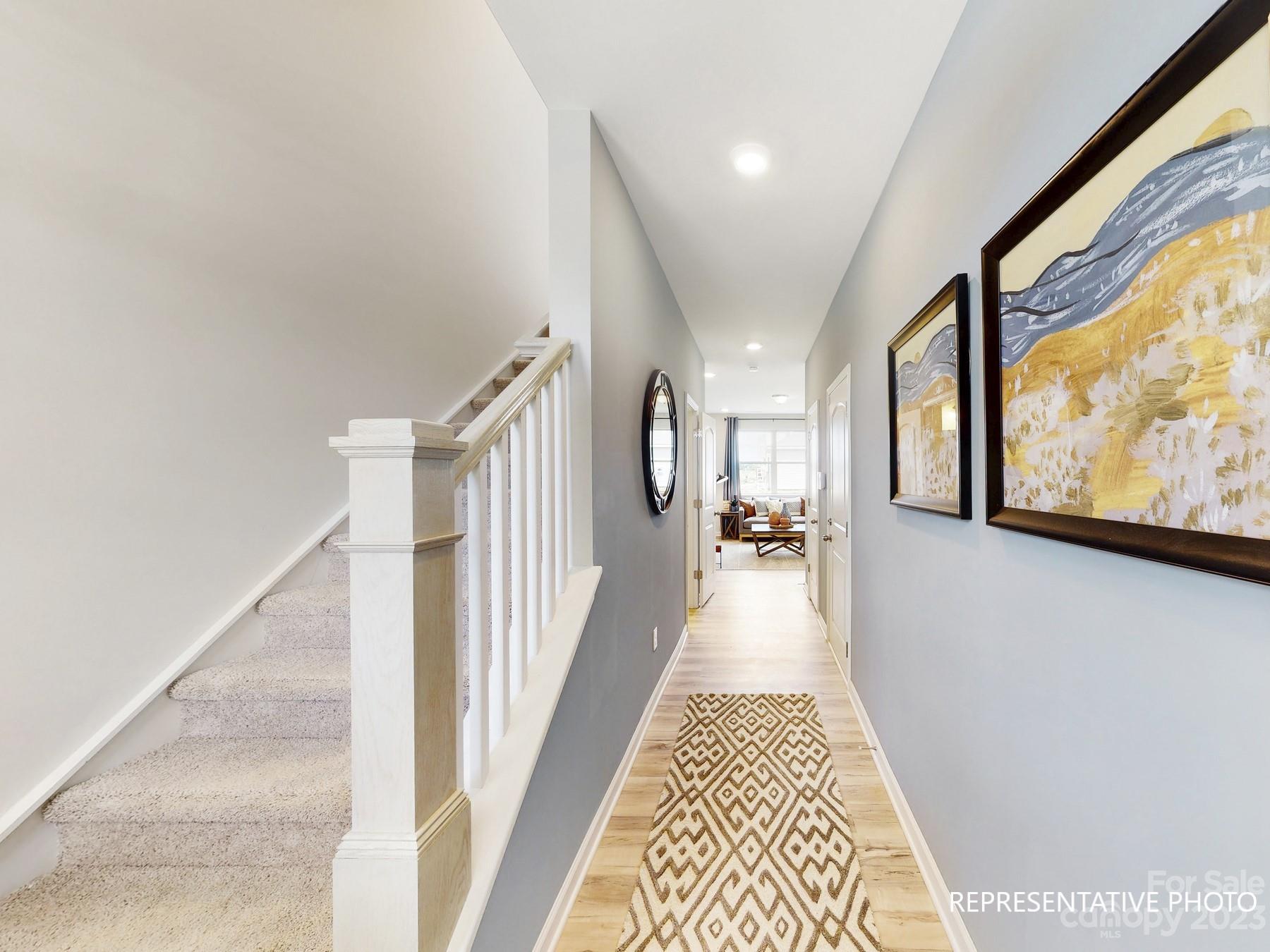4911 Raspberry Knoll Drive, Unit 41 Charlotte, NC 28208 - Photo 9 of 29 a view of a hallway with a couch