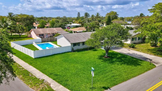 an aerial view of a house with garden