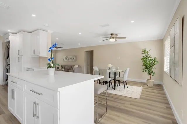 a view of kitchen and sink with wooden floor