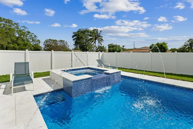 a view of a terrace with swimming pool