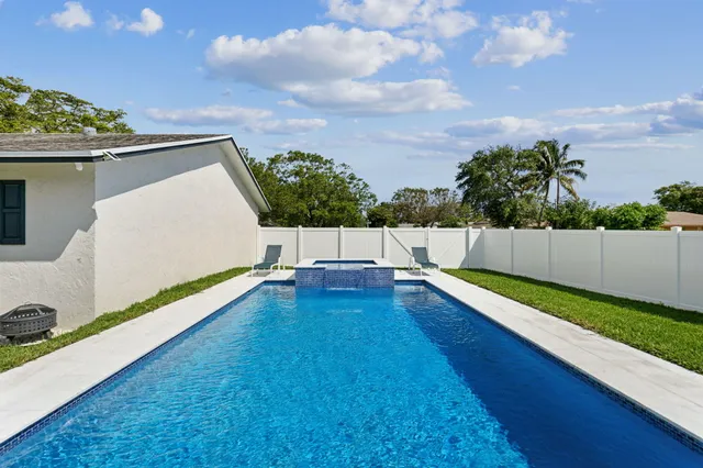 a view of swimming pool with a yard