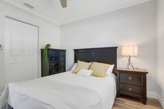 a bedroom with a bed and a lamp