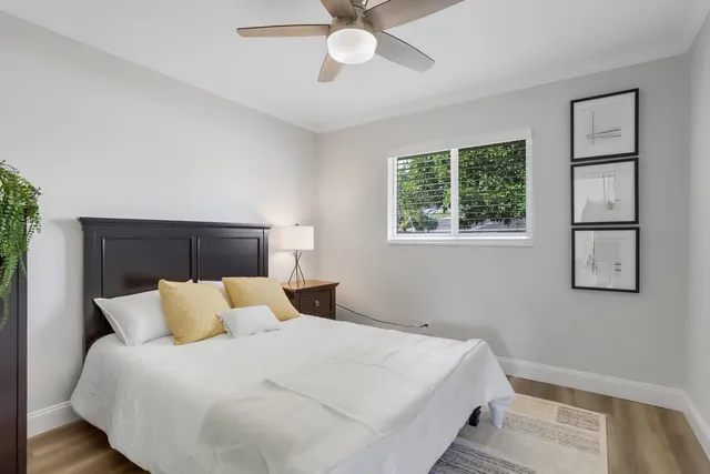 a bedroom with a bed and window