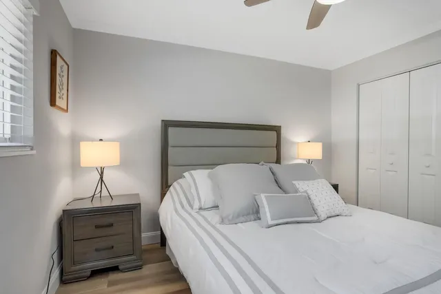 a bed room with a bed and a lamp