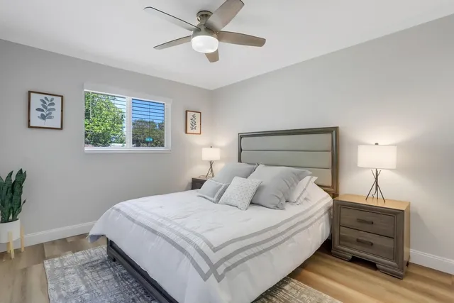 a bedroom with a bed and a window