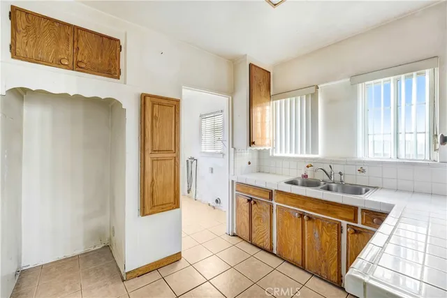 a bathroom with a sink a mirror and a bathtub