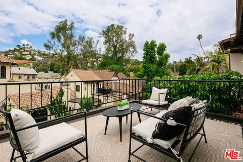 a view of a chairs and table on the deck