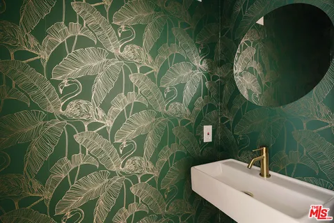 a bathroom with a sink and mirror