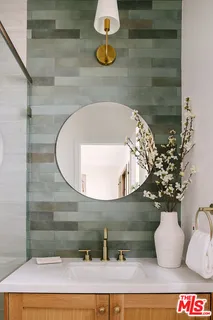 a bathroom with a sink and mirror