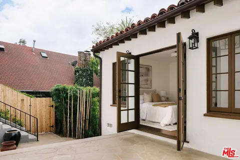 a balcony view with a backyard space