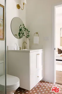 a bathroom with a sink and mirror