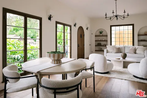 a view of a dining room with furniture window and wooden floor