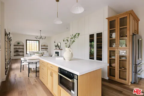 a kitchen that has a lot of cabinets in it