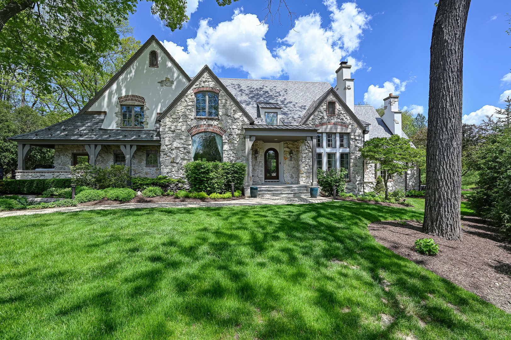 5 Norman Court Burr Ridge, IL 60527 - Photo 1 of 52 a front view of a house with a yard