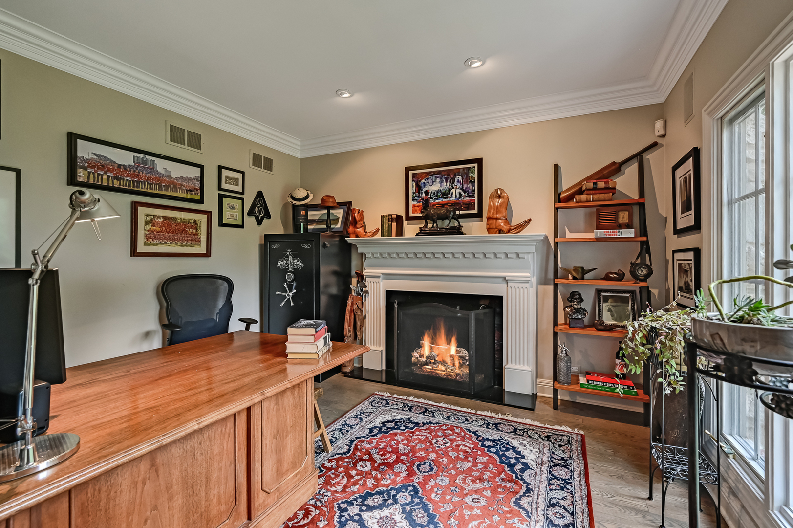5 Norman Court Burr Ridge, IL 60527 - Photo 11 of 52 a living room with furniture a flat screen tv and a fireplace