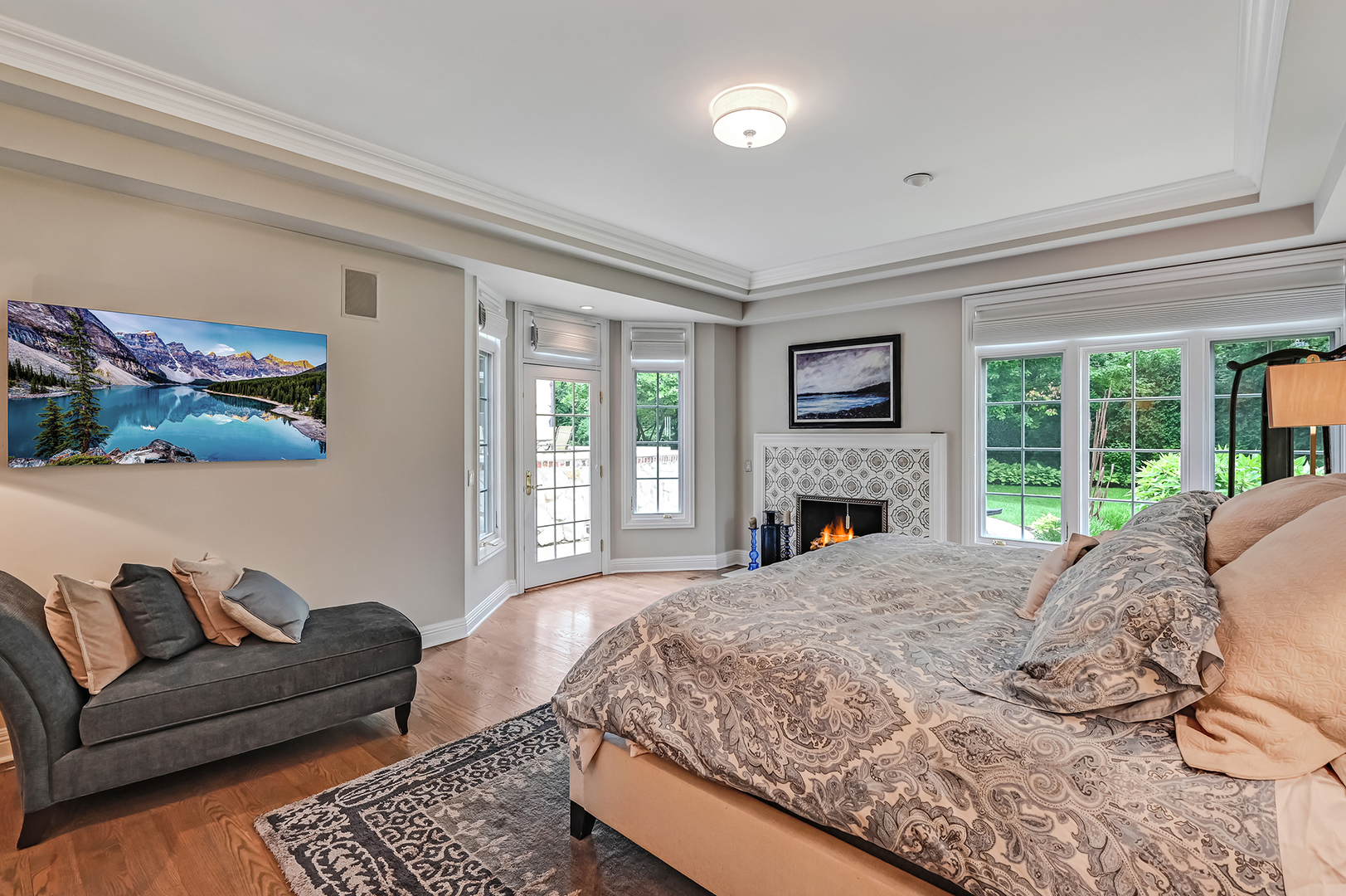 5 Norman Court Burr Ridge, IL 60527 - Photo 23 of 52 a living room with a couch a fireplace and a large window