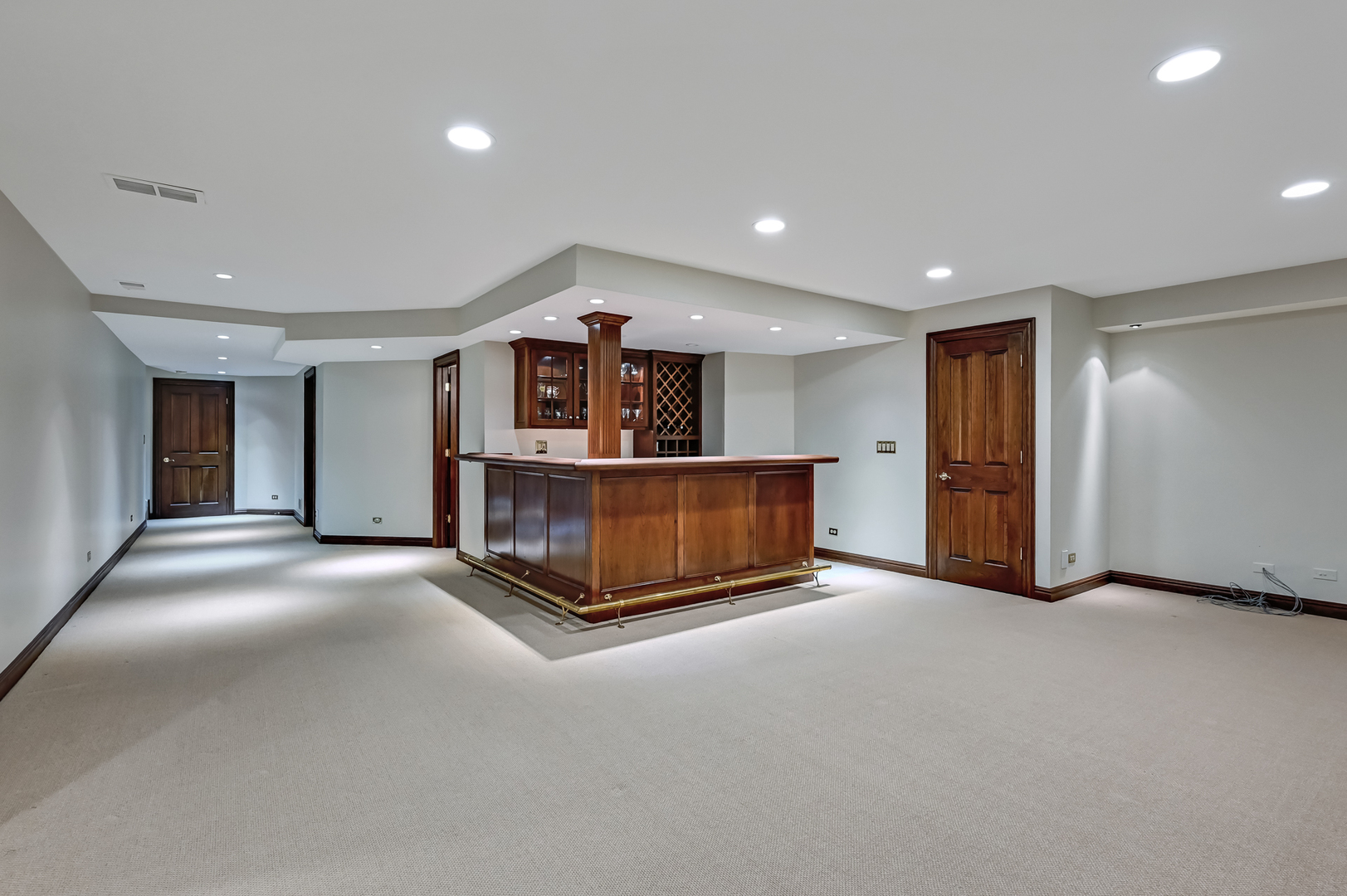 5 Norman Court Burr Ridge, IL 60527 - Photo 39 of 52 a living room with a couch and a ceiling fan