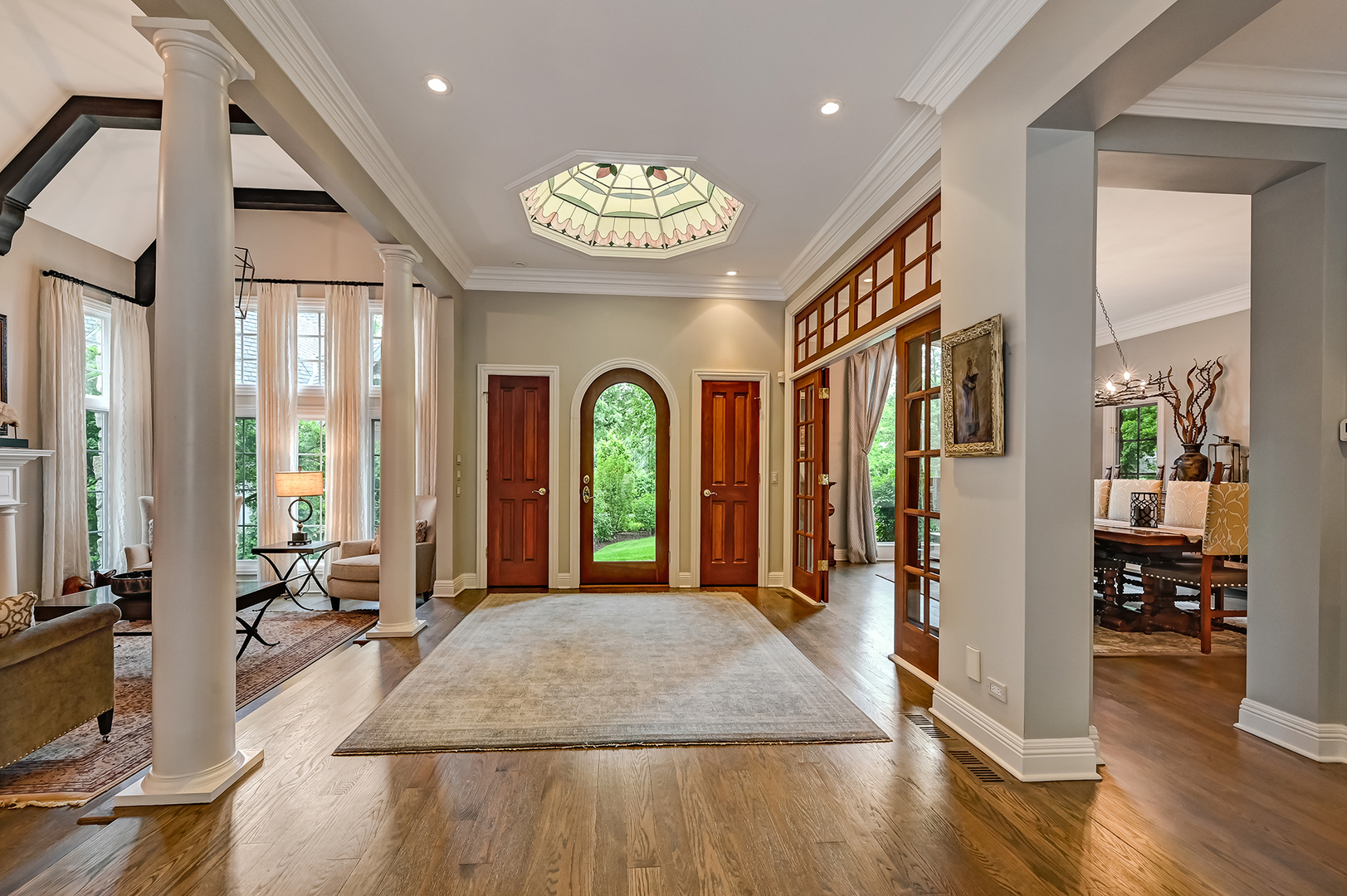5 Norman Court Burr Ridge, IL 60527 - Photo 5 of 52 a view of a hallway with wooden floor and windows