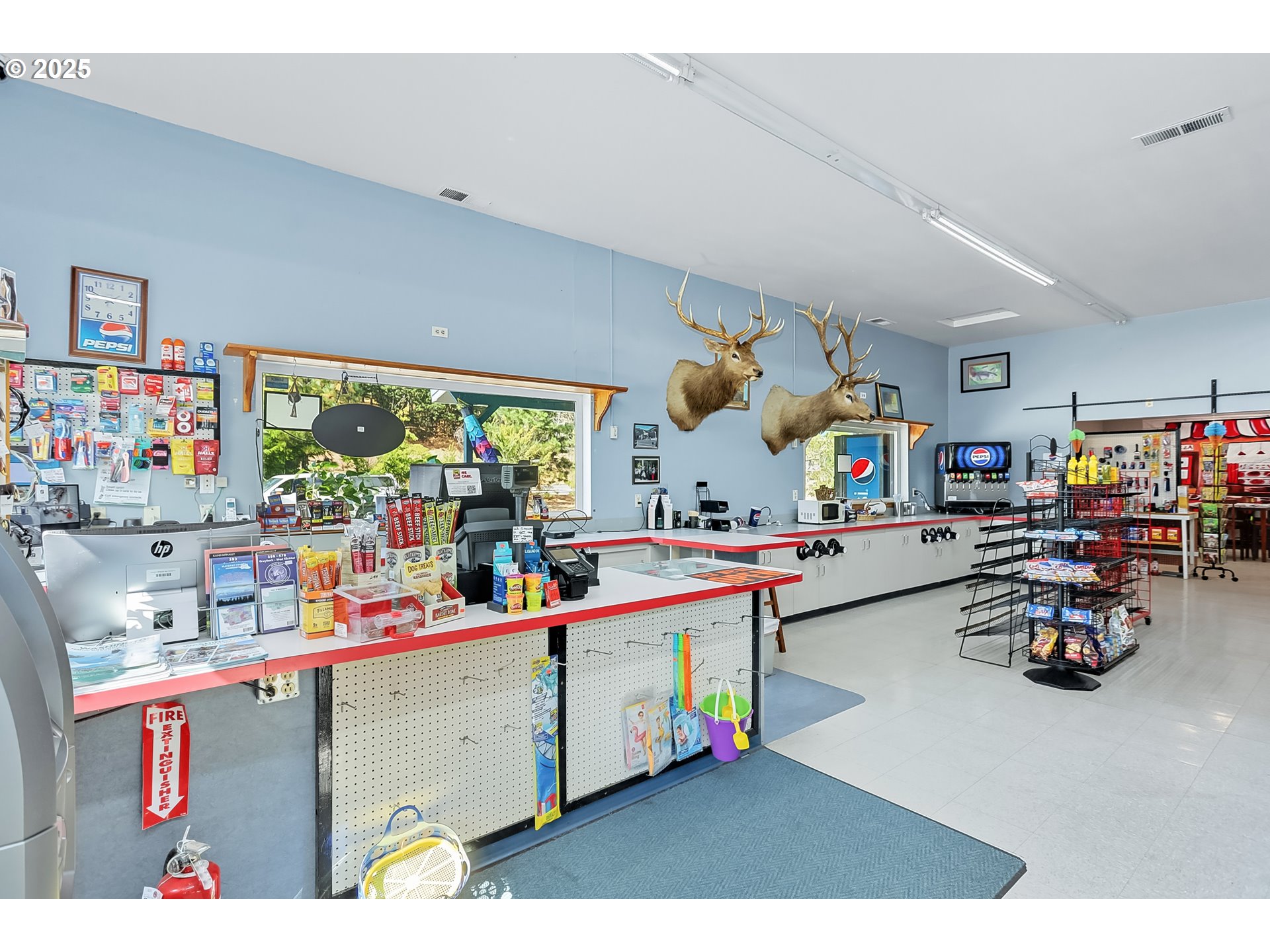 101 Main Street Klickitat, WA 98628 - Photo 14 of 33 a kitchen with lots of clutter and cabinets