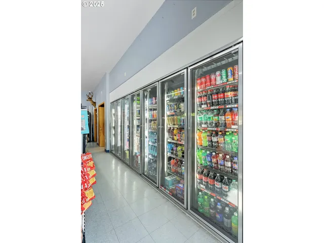 a dining hall with furniture and a wooden floor
