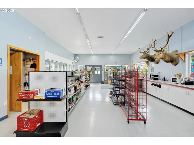 a living room with dining room and flat screen tv