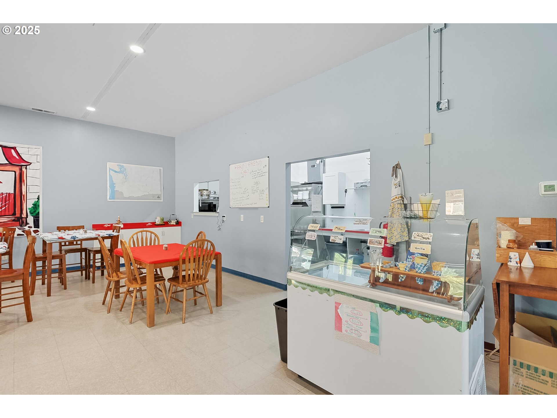 101 Main Street Klickitat, WA 98628 - Photo 19 of 33 a dining hall with furniture and a wooden floor
