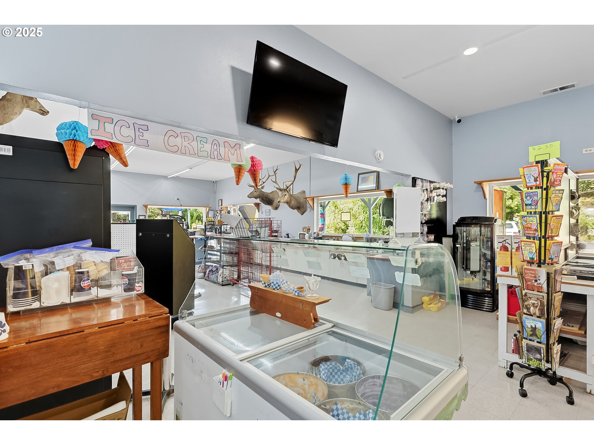 101 Main Street Klickitat, WA 98628 - Photo 20 of 33 a living room with dining room and flat screen tv