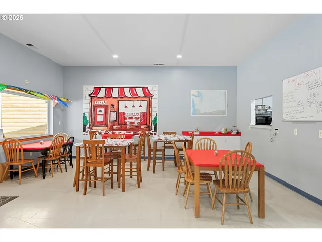 a view of a dining room with furniture window and outside view