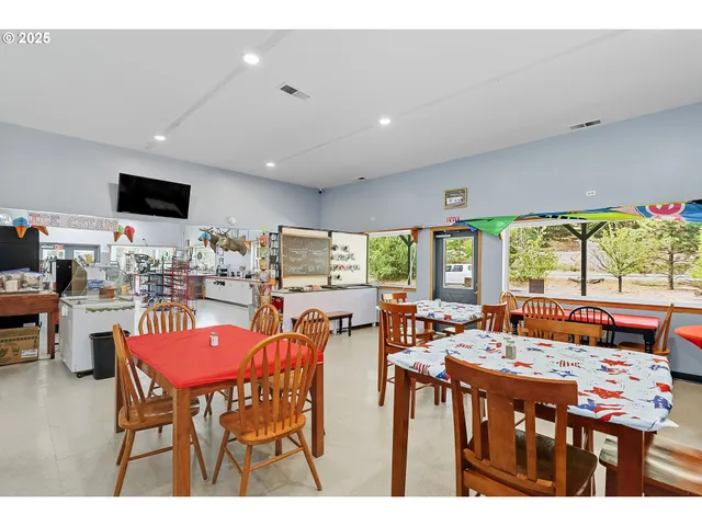 a kitchen with stainless steel appliances granite countertop a stove and cabinets