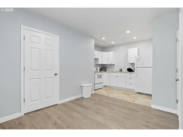 a view of kitchen with wooden floor