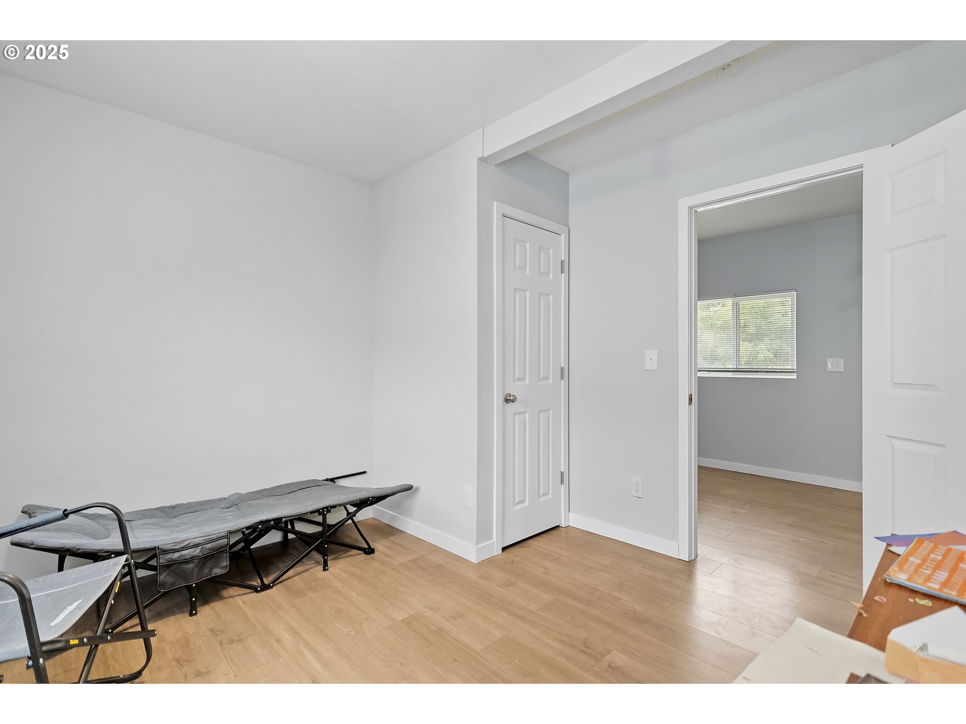 101 Main Street Klickitat, WA 98628 - Photo 7 of 33 an empty room with wooden floor and windows