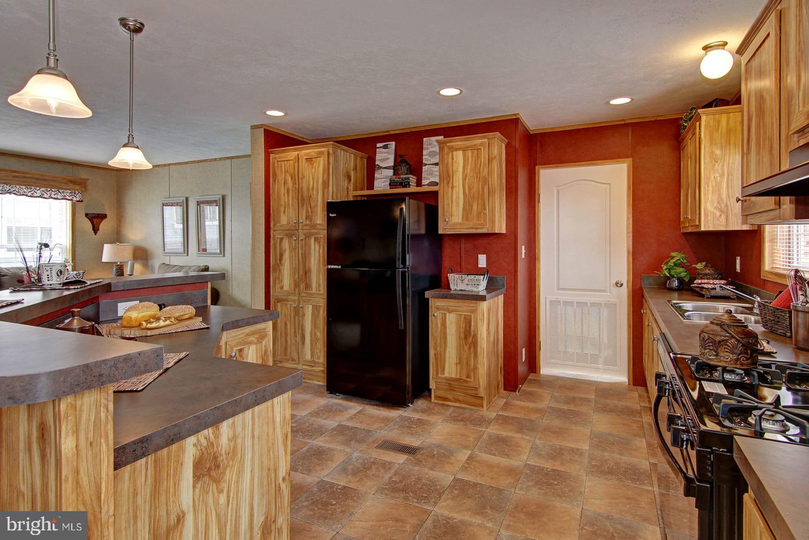 37120 Pinewood Road Ocean View, DE 19970 - Photo 13 of 25 Similar kitchen flooring, cabinets and colors