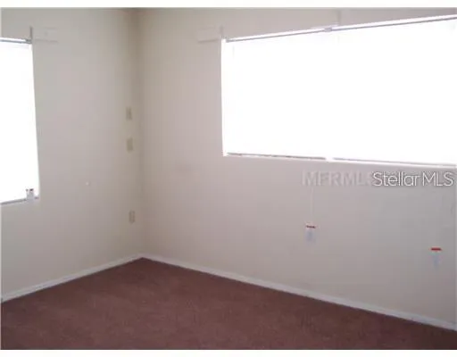 a view of a small space with wooden floor