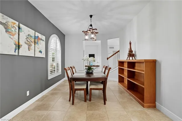 a view of a dining room with furniture and window