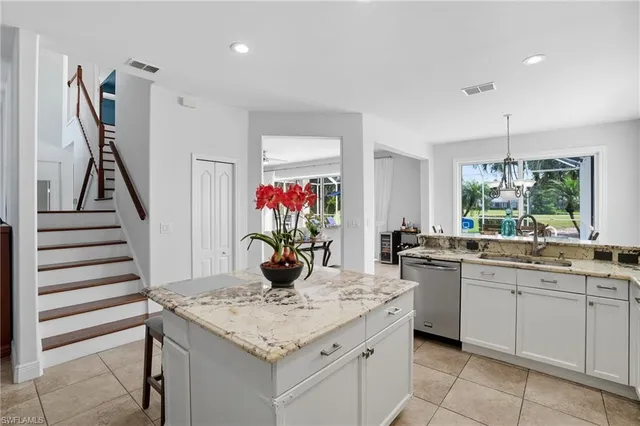 a kitchen with a sink and cabinets