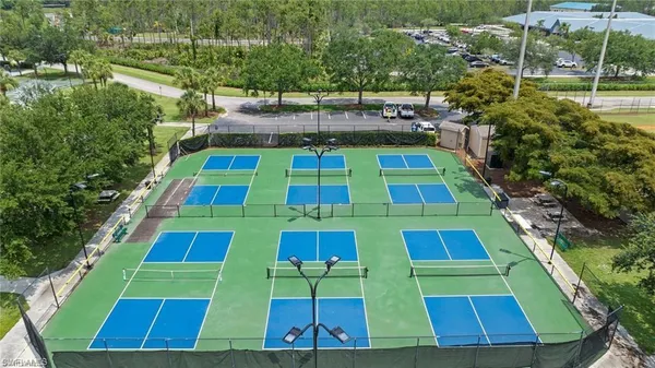 a view of aerial tennis pool yard and outdoor seating