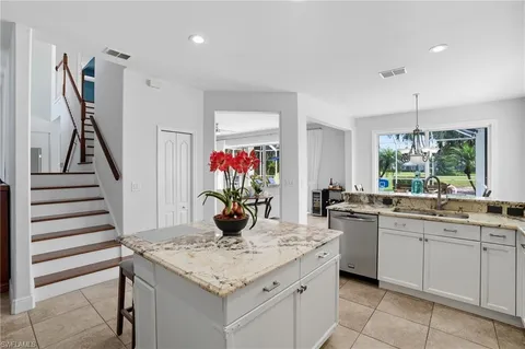 a kitchen with a sink and cabinets