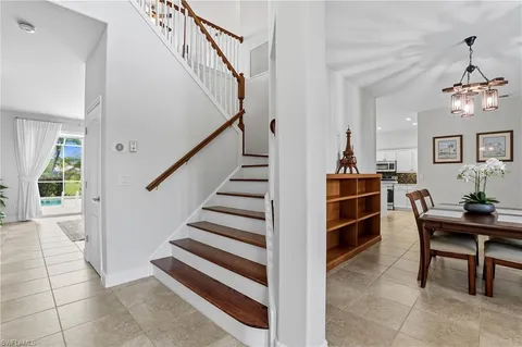 a view of a livingroom with furniture and staircase