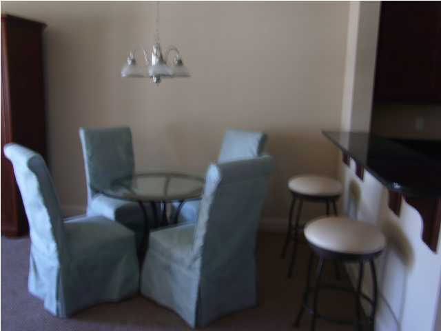 22 South Sand Palm Road, Unit 49 Freeport, FL 32439 - Photo 6 of 15 a view of a dining room with furniture and wooden floor