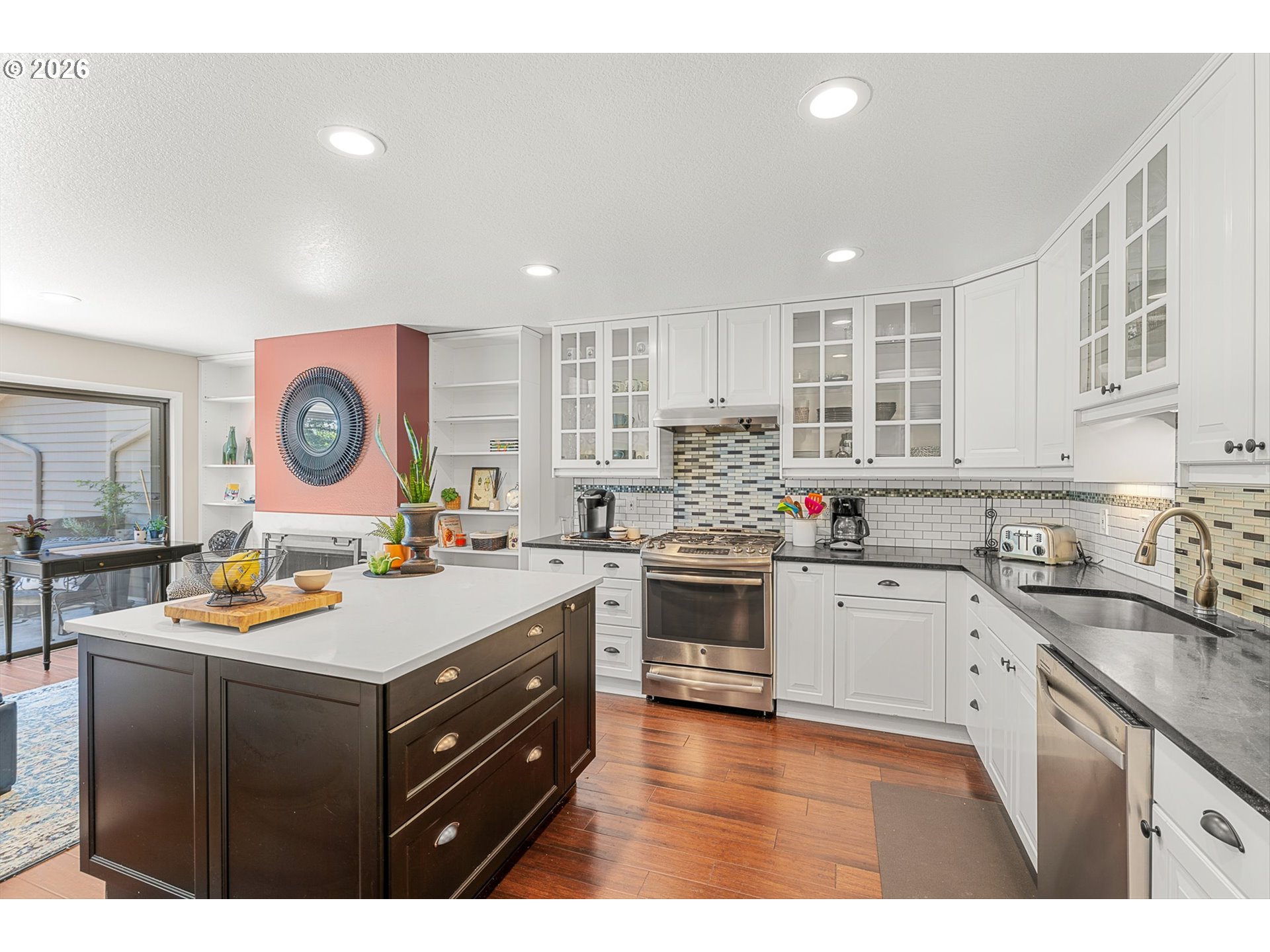77 Condolea Way Lake Oswego, OR 97035 - Photo 3 of 25 a kitchen with a stove a sink and a refrigerator