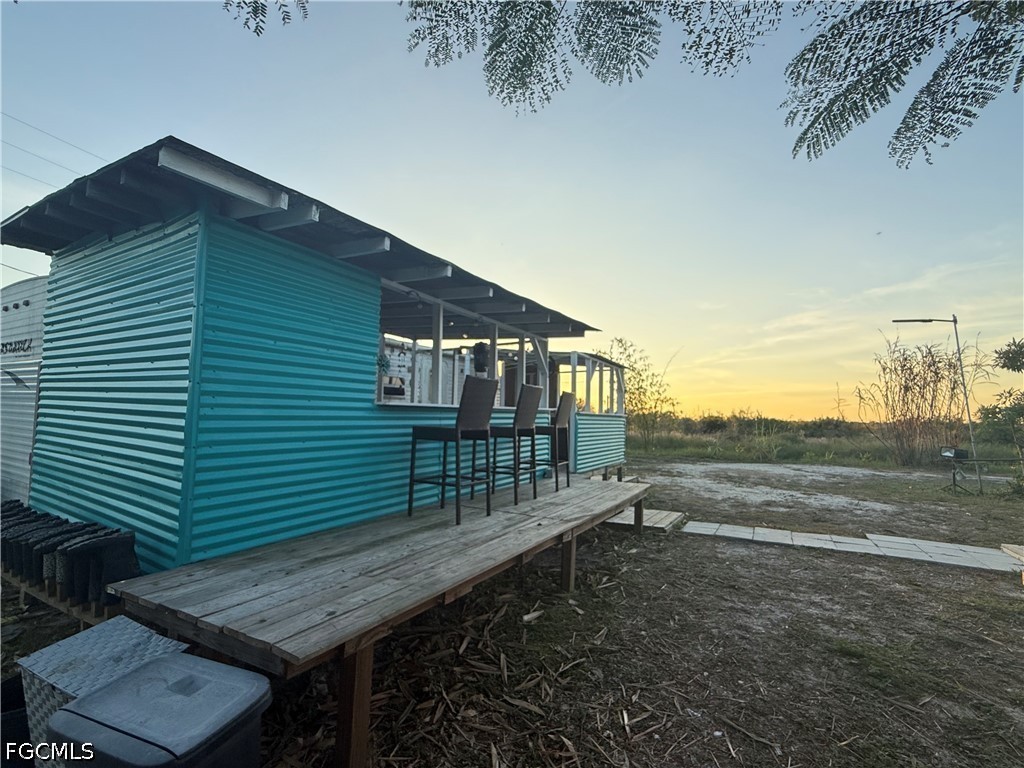6724 5th Road LaBelle, FL 33935 - Photo 20 of 28 a view of backyard with deck
