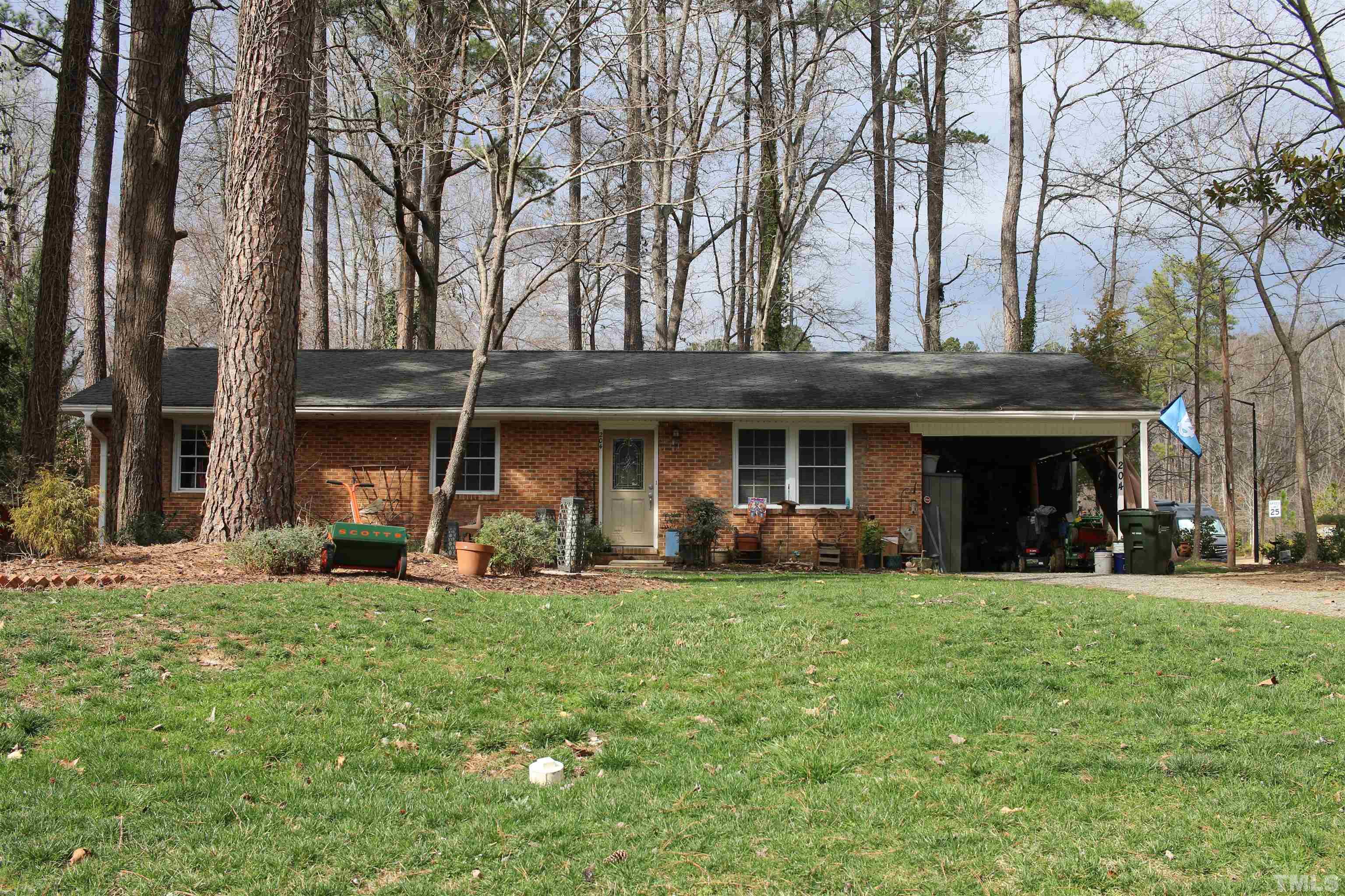 204 Celeste Circle Chapel Hill, NC 27517 - Photo 1 of 12 a view of a house with a yard and sitting area