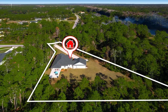 a view of a hallway with wooden floor and a bathroom